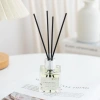 Aroma diffuser, glass bottle aroma diffuser, black oil absorber, label, white circular base, aroma diffuser, portable aroma diffuser, flame fireplace, automatic aroma diffuser, two-fluid aroma equipment Application Scenario